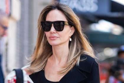 Angelina Jolie Wore A Winter Coat In Mid August